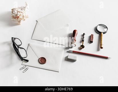 Blank stationery with envelopes on paper surface. Responsive design mockup. Stock Photo