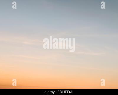 Soft Sunset Sky with Gradient Clouds at Dawn or Dusk Stock Photo
