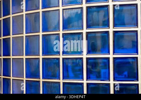 Close-up abstract of blue glass square window bricks in the foyer of a vintage mid-century building. Stock Photo