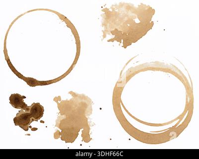 Various coffee stains, cup circles and shapeless spots with different color intensities, small splashes, isolated on white background. Stock Photo