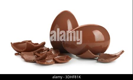 Whole and broken chocolate eggs isolated on white. Happy Easter Stock Photo