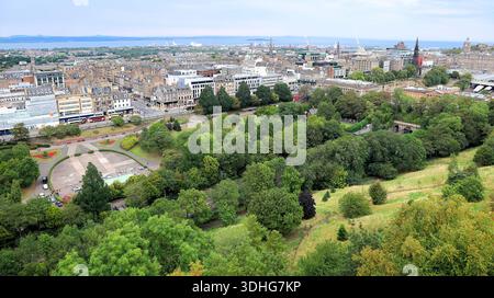 Wide-angle view of the city of Edinburgh, looking down from the castle over Prince's gardens and street. Stock Photo