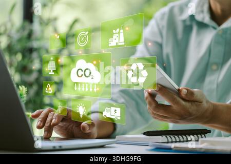 Finance manager implemented digital technology to monitor CO2 emissions, reducing risk and promoting sustainable energy practices for an eco-friendly Stock Photo