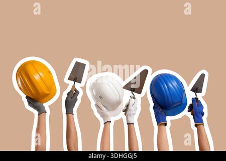 Hands with hardhats and construction tools on beige background Stock Photo