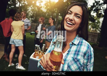 Beer, laughing and portrait of woman at party for break, celebration or social gathering event. Alcohol, funny and reunion with happy girl drinking Stock Photo