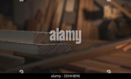 Sundrenched Workshop Featuring Carefully Arranged Wooden Boards With Visible Grain Textures And Tidy Layout. Media Stock Photo