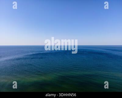 Minimalistic Aerial View of Open Sea and Horizon Under Clear Sky Stock Photo