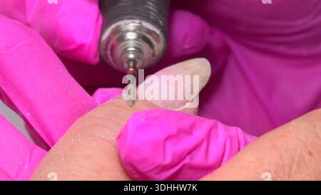Technician Meticulously Shaping Nails, Closeup View Of Technician Refining Client Finger Nails Carefully. Media Stock Photo