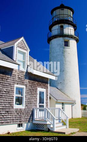 Highland Lighthouse and buildings against brilliant blue sky Massachusetts Cape Cod Stock Photo