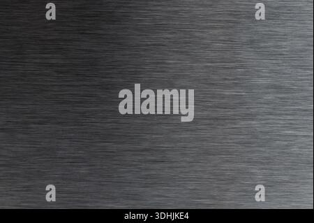 Dark grey brushed iron metal background texture macro close up view Stock Photo