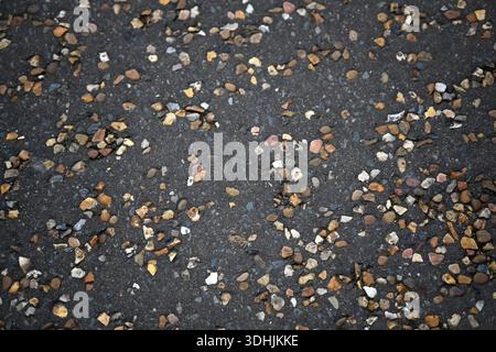 Concrete floor with embedded gravel for use as a background texture Stock Photo