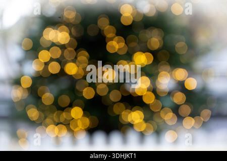 Defocused view of lights on Christmas tree Stock Photo