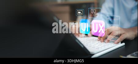 Web designer hands typing on keyboard developing application. UI UX interface design concept with virtual wireframe, AI technology icons, and coding e Stock Photo