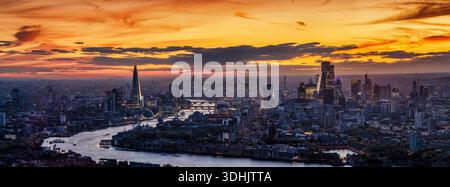 Beautiful, panoramic view of the 2025 London skyline just after sunset with city lights and colorful cloudscape Stock Photo