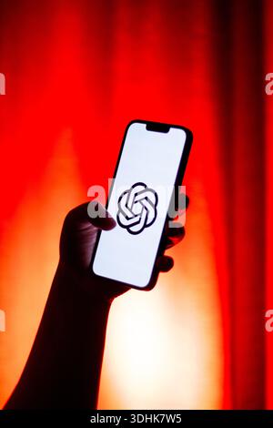 Kaliningrad, Russia - 12.11.2025. Smartphone screen in woman hands displaying logotype of popular AI application Chat GPT. Chatbot, prompts, generatin Stock Photo