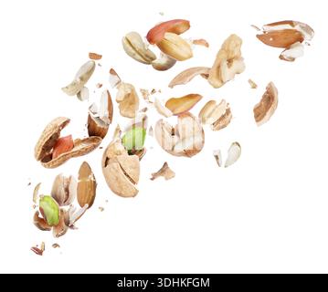 Various nuts crushed in the air on white background Stock Photo