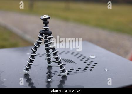 A mini flexible bendy camera tripod, photographers or filmmakers equipment Stock Photo