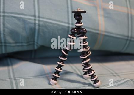 A mini flexible bendy camera tripod, photographers or filmmakers equipment Stock Photo