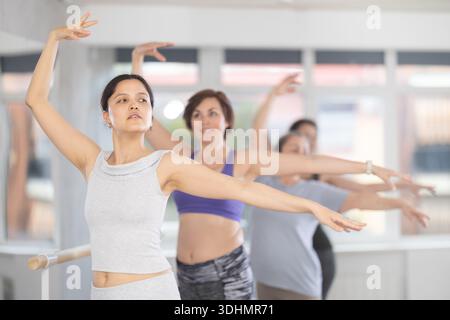 Group of women beginners practicing at ballet barre Stock Photo
