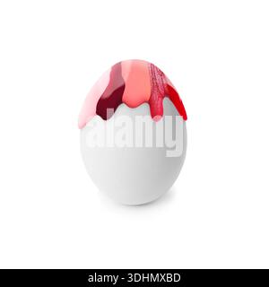 Colorful paint dripping down egg on white background. Easter celebration Stock Photo