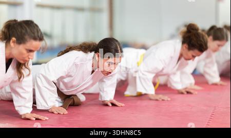 Women doing push-ups in training Stock Photo