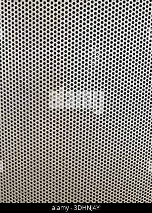 Close Up Of Aluminum Panel Covered In Drill Hole Grid Background Image Stock Photo