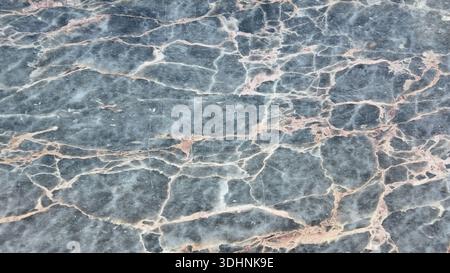 Dark marble surface with light veins and patterns Stock Photo