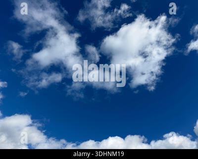 Fluffy clouds in the blue sky Stock Photo
