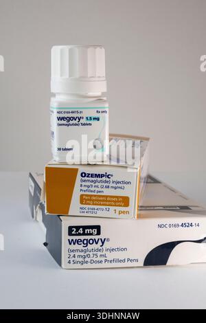 Photo Illustration of the new Wegovy semaglutide tablets on a white  background with out of focus injection pen. Its a prescription medicine  used with Stock Photo - Alamy