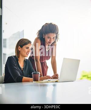 Business, woman or mentor with advice on laptop for corporate training, account question or help. Team, finance intern or manager with tech in office Stock Photo
