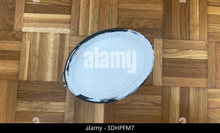 Top view of paint bucket for home repair and wall renovation creative DIY interior painting setup Pro Photo. High quality photo Stock Photo