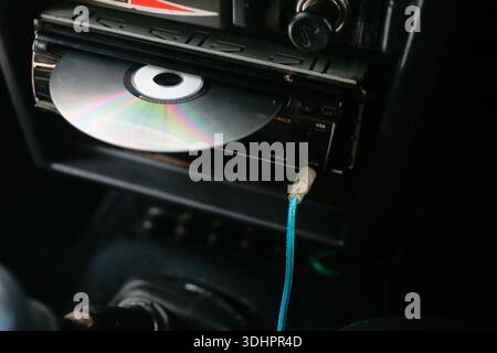 close up of dvd player with disk on head unit audio car Stock Photo