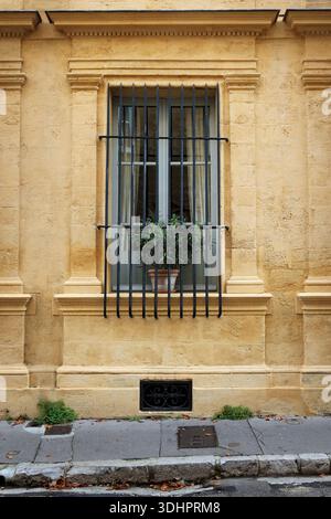 Window with fence of stone building in provence Stock Photo