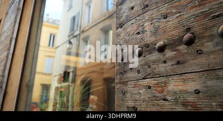 view of window with shutters of stone building in provence Stock Photo