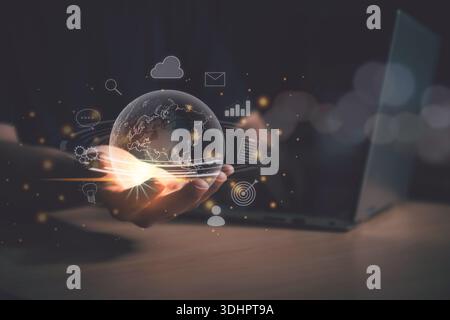 Man Hand holding virtual Global with technology and business icon for metaverse world. Globalisation and Digital business technology transformation co Stock Photo