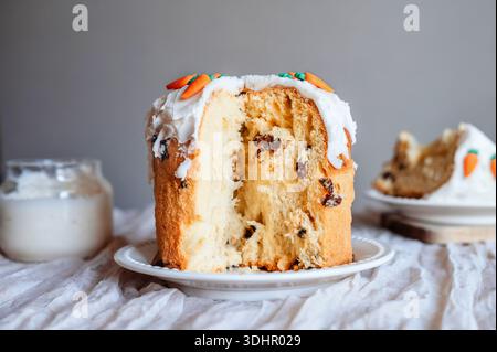 Homemade Easter cake with icing and visible cut section. Stock Photo