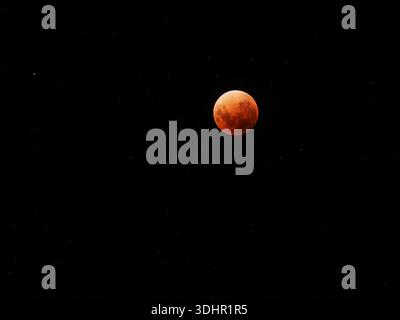Red moon during a rare total lunar eclipse which was a Super blue blood moon. Stock Photo
