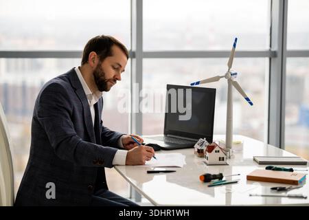 Engineer working on renewable energy project Stock Photo