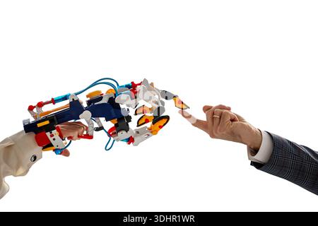 robotic arm touches a human finger. STEAM education Stock Photo