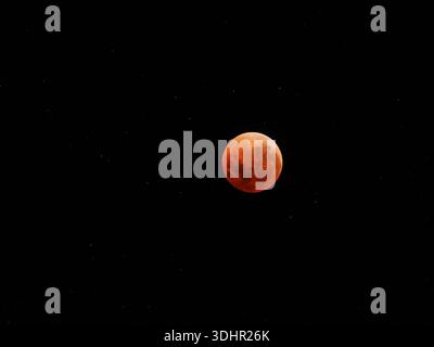 Red moon during a rare total lunar eclipse which was a Super blue blood moon. Stock Photo