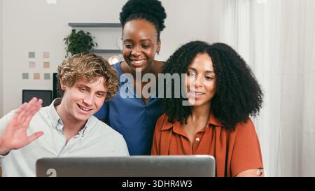 Trio Tech Team: Diverse Friends Collaborating On Laptop In Startup Office Space Open Bright Environment Stock Photo