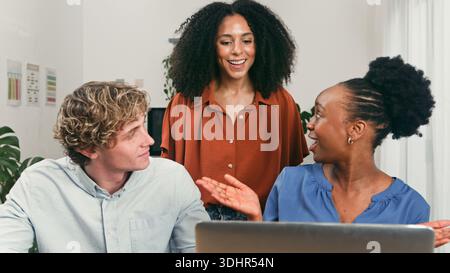 Diverse Team Members Engage in Friendly Startup Brainstorming Session at Modern Office Stock Photo