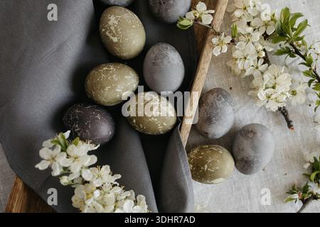 Easter holiday. Painted olive-colored eggs on a linen tablecloth. Easter decoration. Stock Photo