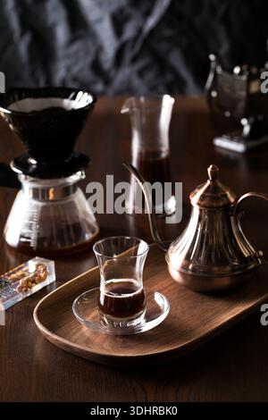 Professional pour over coffee brewing set with kettle and glass dripper Stock Photo