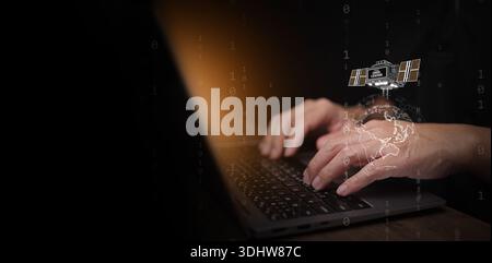 Space based data center concept. Man using laptop with orbital satellite orbiting around the globe. Information storage technology, AI computing infra Stock Photo