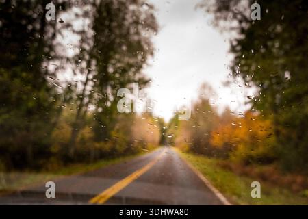 Rain drops on the windshield of a car. Stock Photo