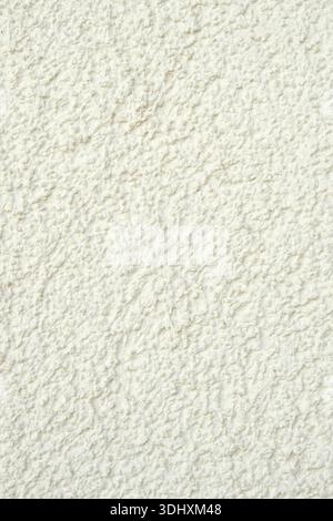 White Rough Plastered Wall Seamless Background Texture. Stock Photo