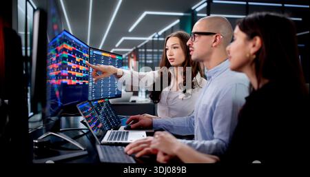 Agile Team In Office Using Kanban Board For Task Management. Stock Photo