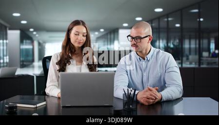 Team Of Diverse Professionals Collaborating On Business Methodology In Meeting Room. Stock Photo