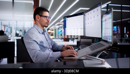 Man Using Online Document Management Software For Efficient Contract Storage. Stock Photo